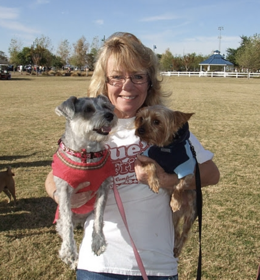 Sue Higbee Holding Two Dogs